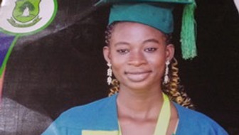 Ernestina wearing a graduation cap and gown