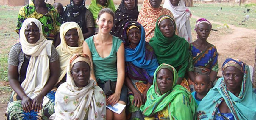 Leah seated with a group of women outdoors