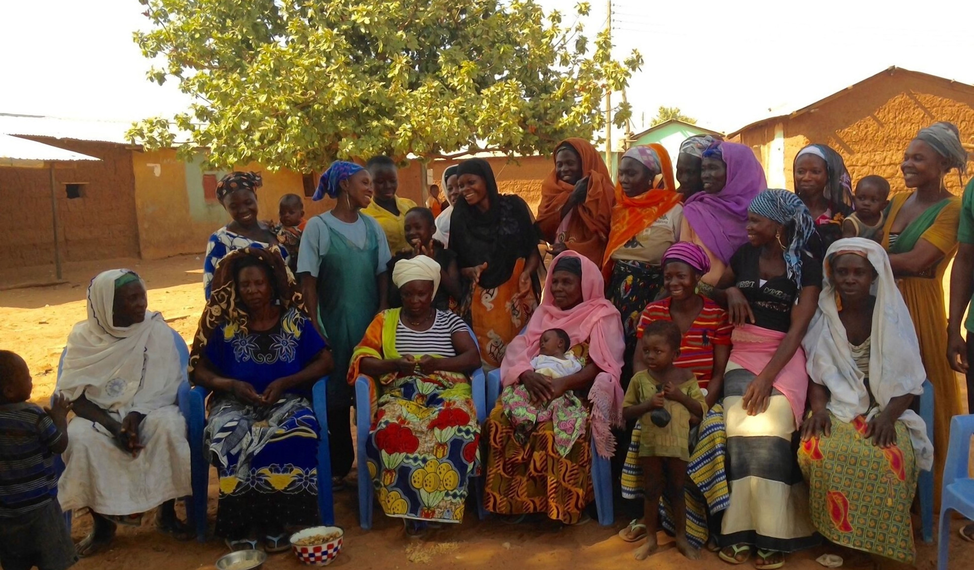 A group of women gathered outdoors in Larabanga