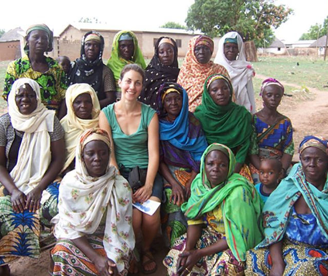 Leah seated outdoors with women in Ghana